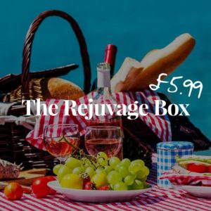 image of food and wine at a picnic for a banner about the rejuvage box