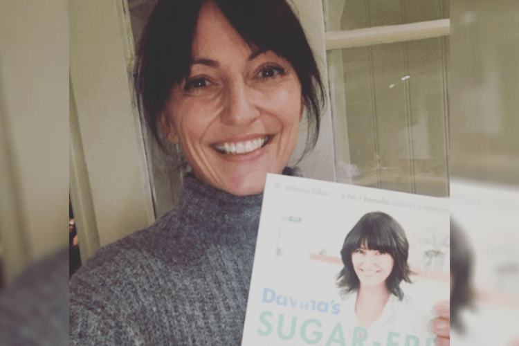 image of davina mccall with her book for an article about the benefits of giving up sugar