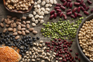 An image of piles of a variety of healthy organic legumes.