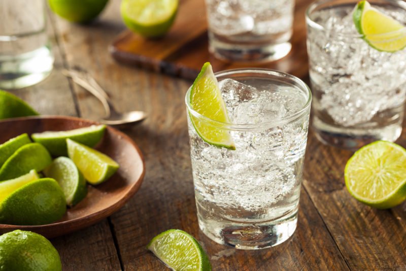 Image of a gin and tonic with sliced lime for an article about record breaking gin sales