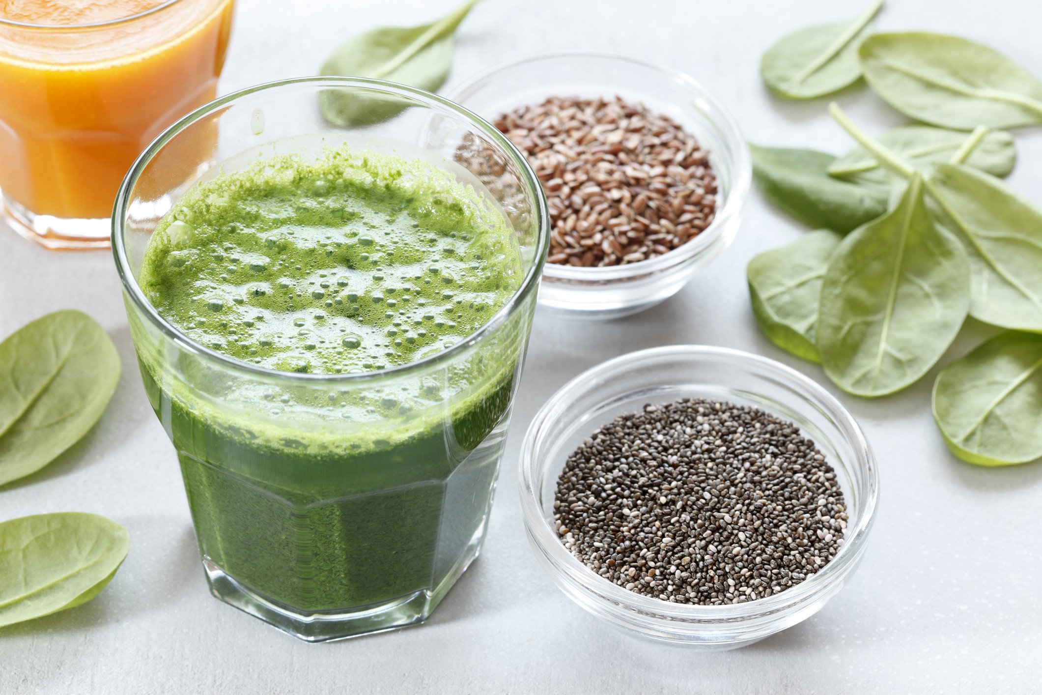 An image of a Green superfood smoothie with spinach and seeds.