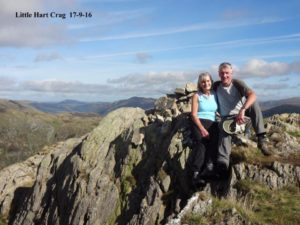 image of two walkers at the top of a cliff after a long walk for a blog about walking and age amazing
