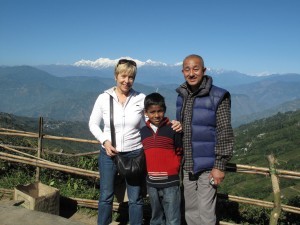 An image of Ulla and friends with a spectacular view of indian mountains in the background.