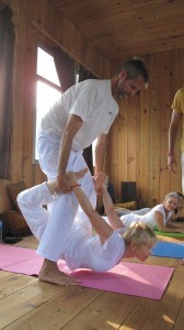 An image of Ulla doing yoga with her instructor.
