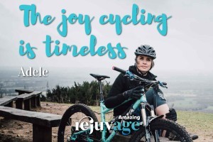 An image of Adele sitting with her mountain bike and her quote superimposed, 'the joy of cycling is timeles'.