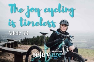 An image of Adele sitting with her mountain bike and her quote superimposed, 'the joy of cycling is timeles'.