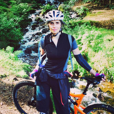 An image of Adelle Mitchell with her mountain bike.