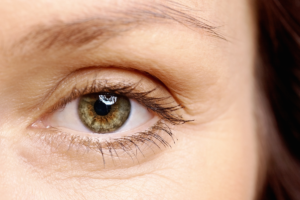 A close up image of a mature woman's eyebrows.