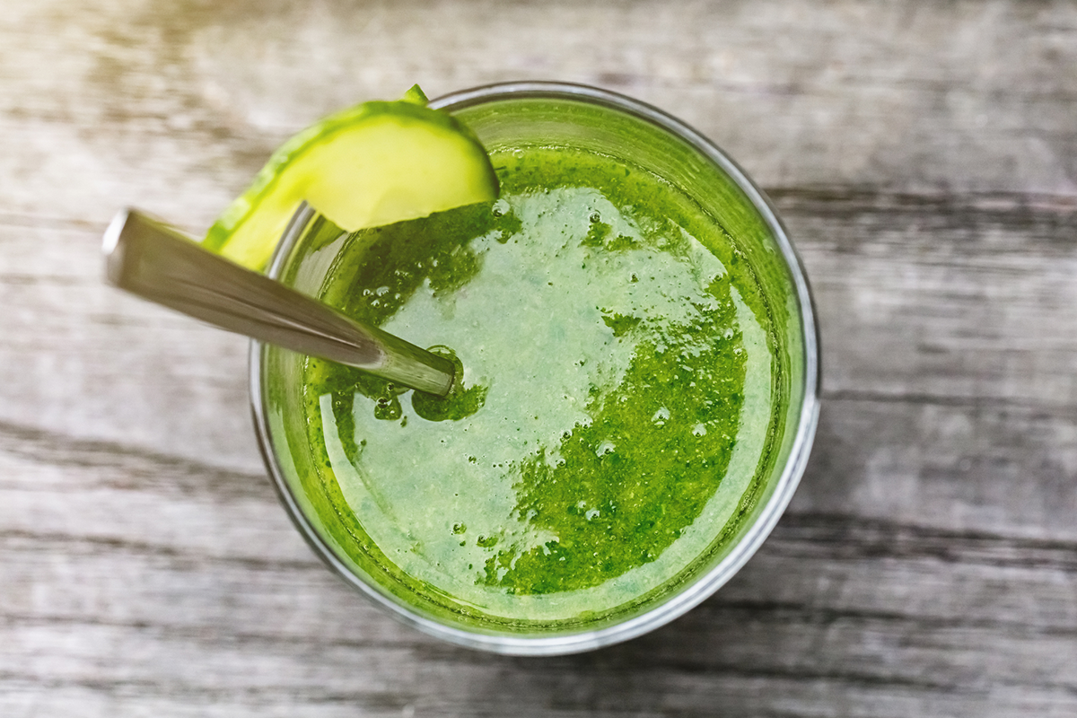 An image of a healthy breakfast consisting of a green smoothie.