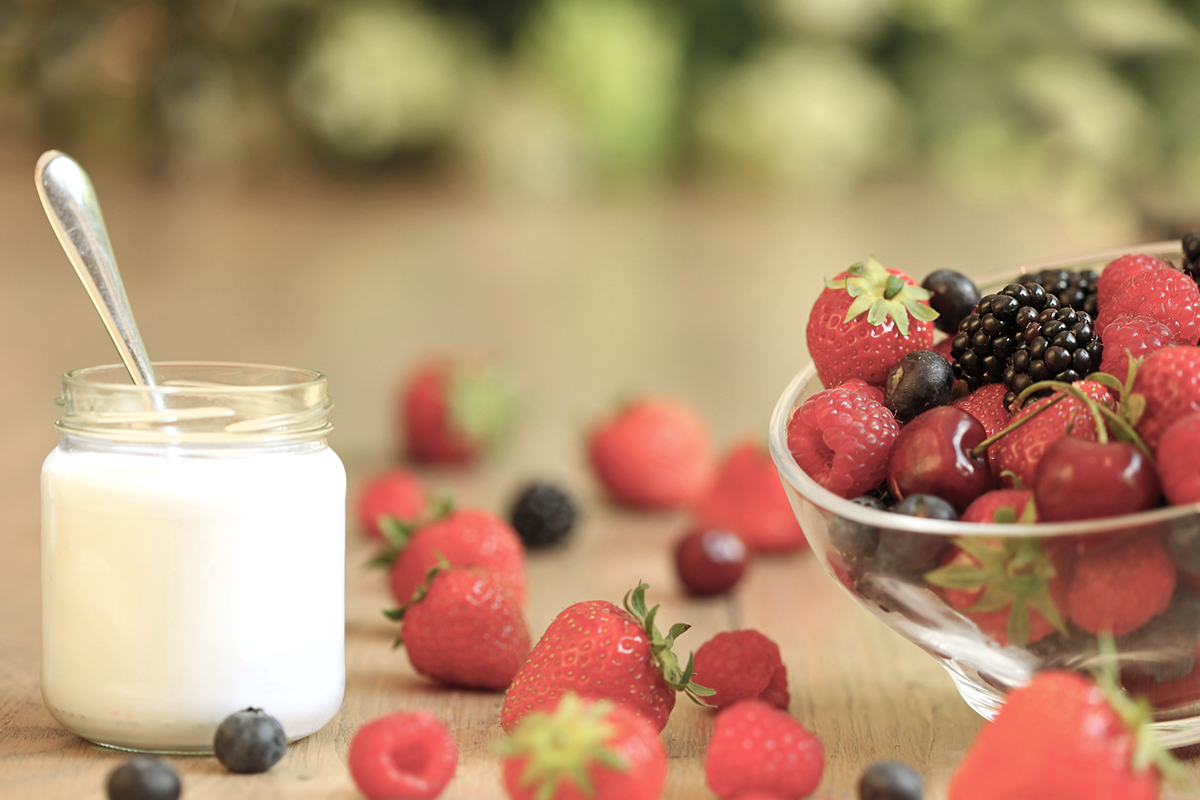 An image of a healthy breakfast including mixed berries and greek yoghurt.