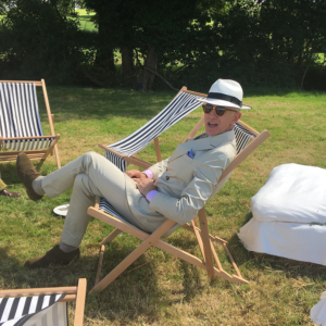 An image of the stylish midster David Evans aka Grey fox blog sitting in a deck