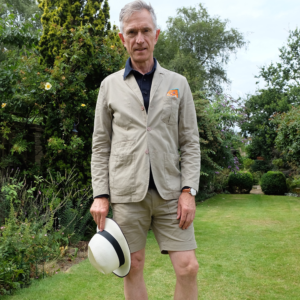 An image of David Evans aka Grey fox blog in a stylish and tailored tan summer suit