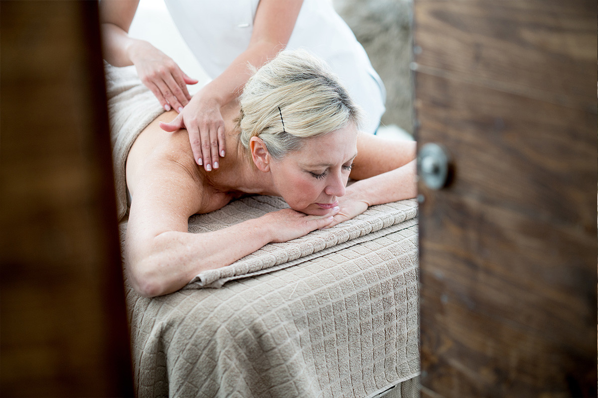 An image of a middle aged woman getting a lymphatic stimulating massage.