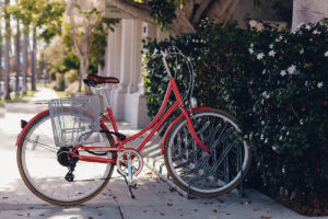 An image of a rented red bike in the street.
