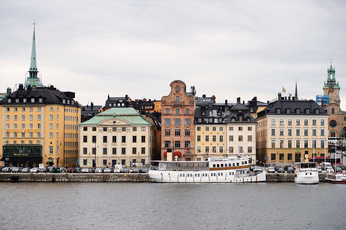 An image of beautiful old architecture sitting by the river in central Sweden.