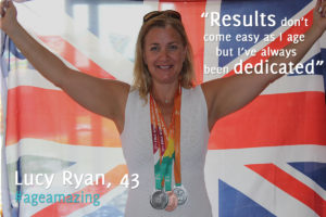 An image of 34 year old Lucy Ryan holding a union jack in celebration after winning three medals at the World Masters Championships