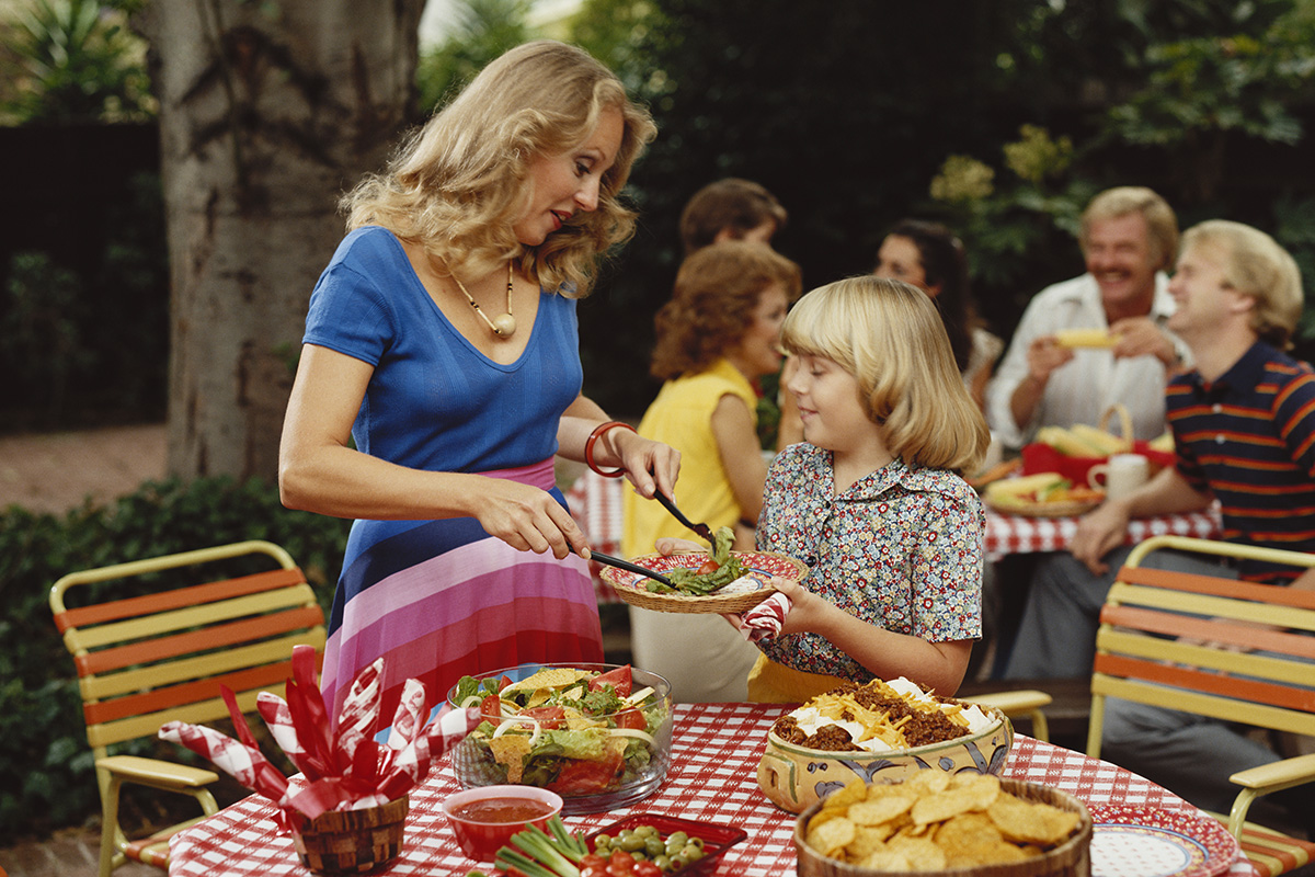 An image of a family having a lunch party in the 1980s.