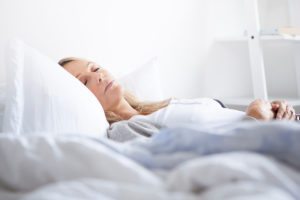 An image of a tired mature woman sleeping.