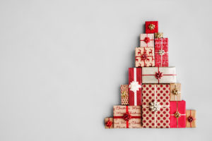 presents stacked up in the shape of a Christmas tree