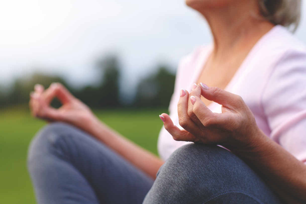 close up of a woman's hands in meditation