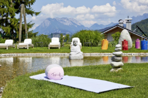 exotic luxury wellness centre with scenic lush green surroundings and mountainus backdrop