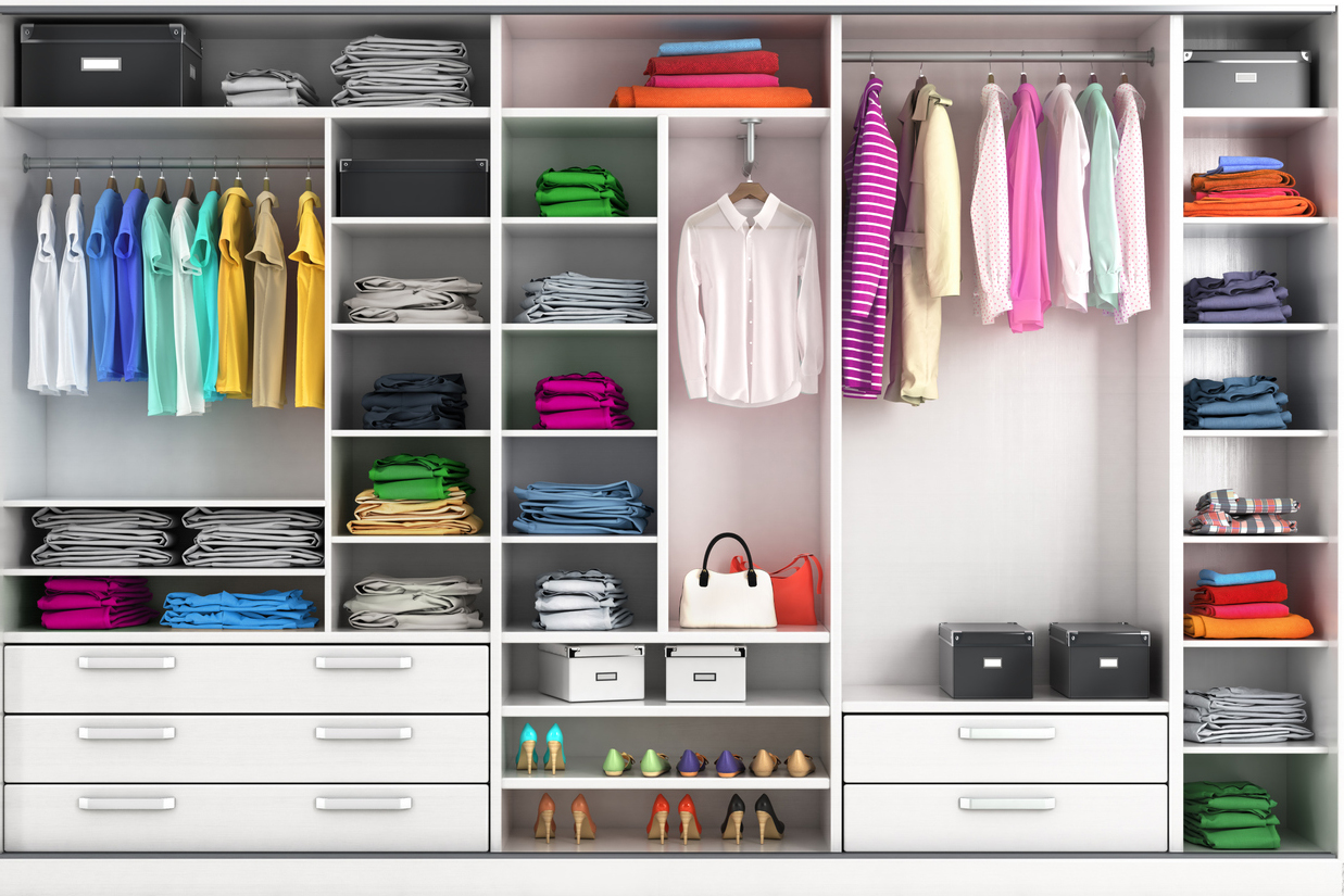 3D illustration of a fitted wardrobe with brightly coloured clothes and lots of compartments