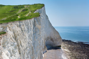 View of the white chalk cliffs in the morning, Seaford Head, East Sussex, England, part of Seven Sisters National park, selective focus. View of the crack on the cliff