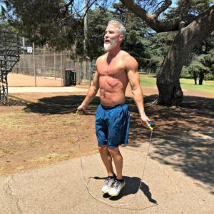 strong mature man skipping outside