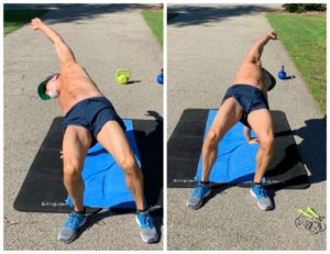 strong mature man practicing a mobility movement on his feet and hands
