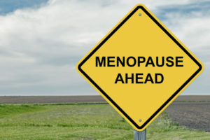 road sign saying 'menopause ahead'