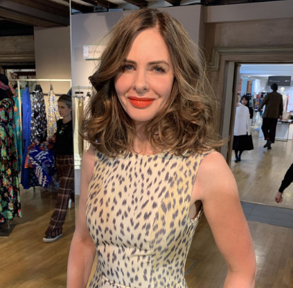 Trinny Woodall wearing a leopard print top smiling at camera