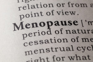 close up of text in a book with the word menopause in bold