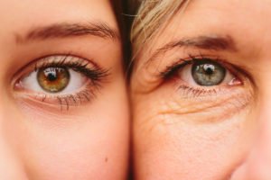 close up of mother and daughters eyes next to each other