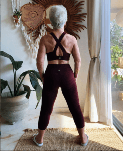 woman in her 70's showing back muscles