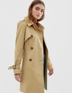woman in long trench coat