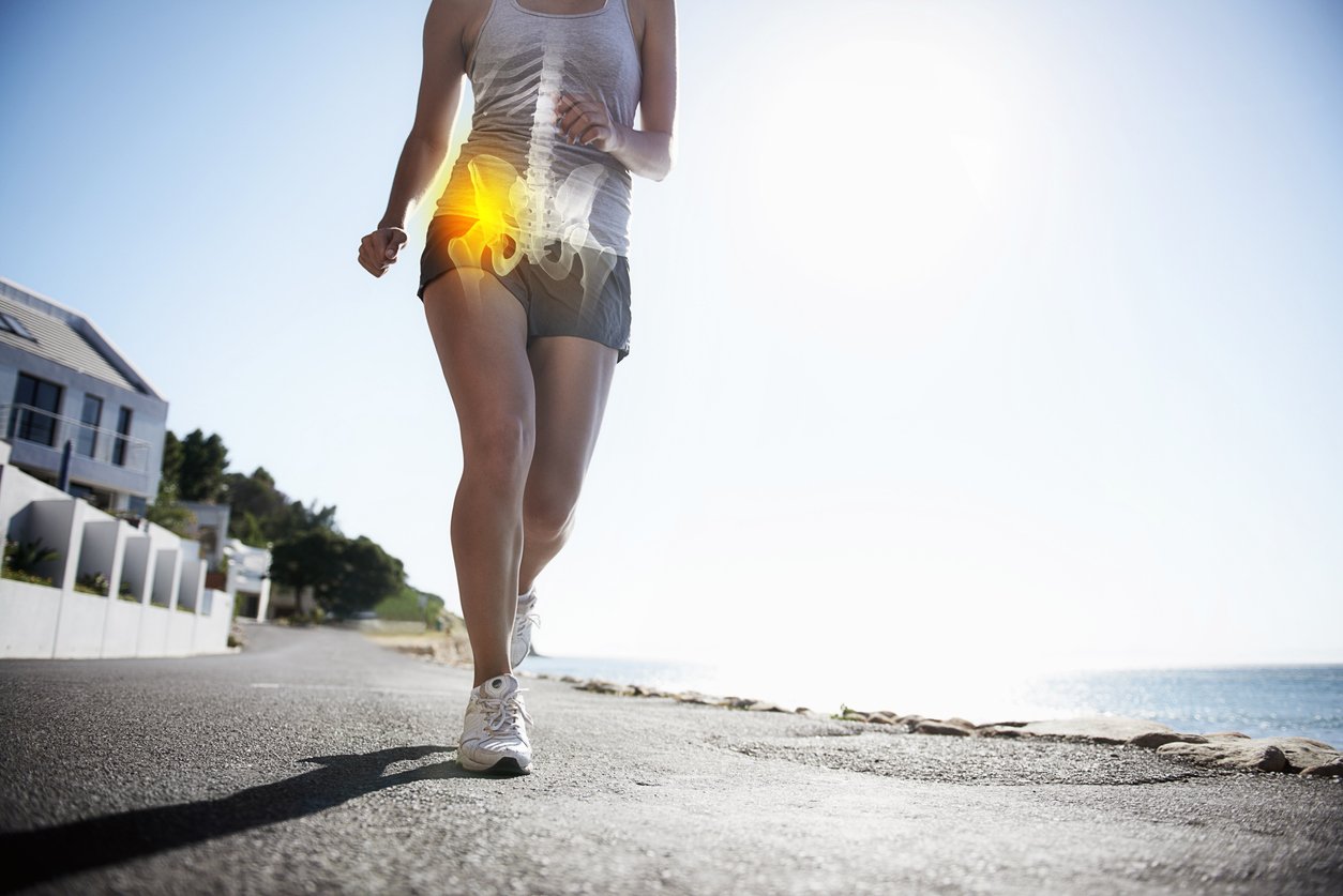 female jogger experiencing joint pain with inflamation