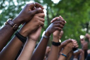black lives matter protest close up of hands being held in the air